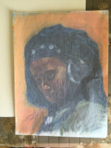 pastel portrait protected by glassine paper and foam board